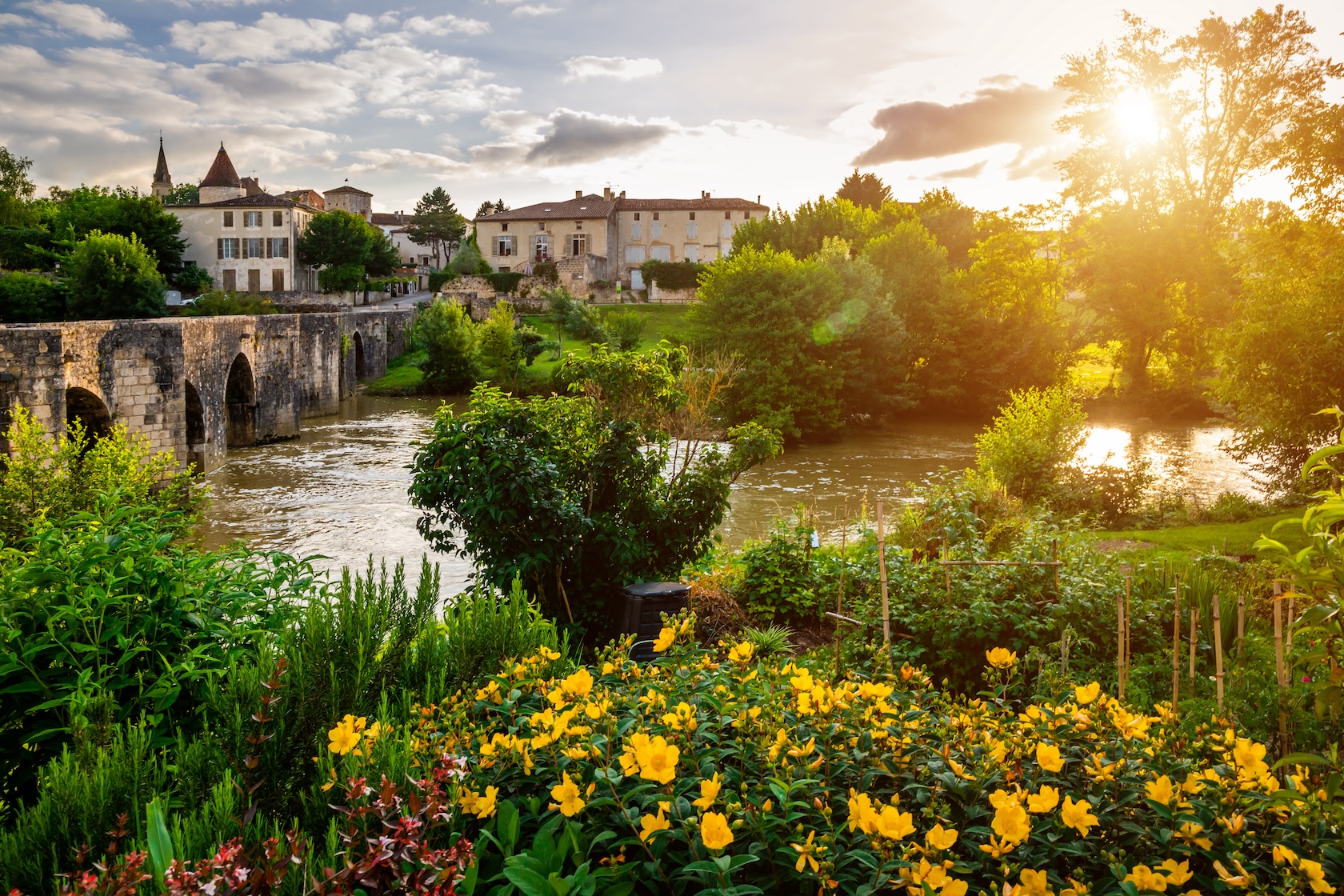 Medieval bridge and Barbaste village on background