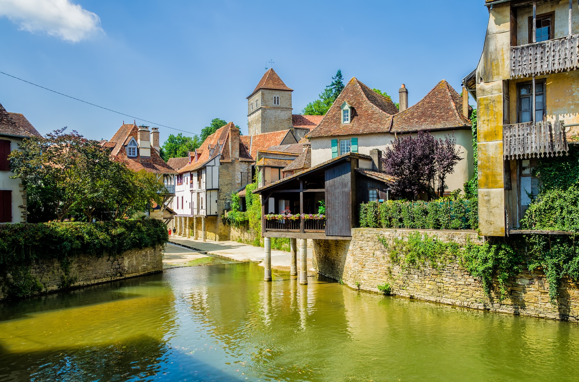 River and buildings in Salies de Bearn, France.